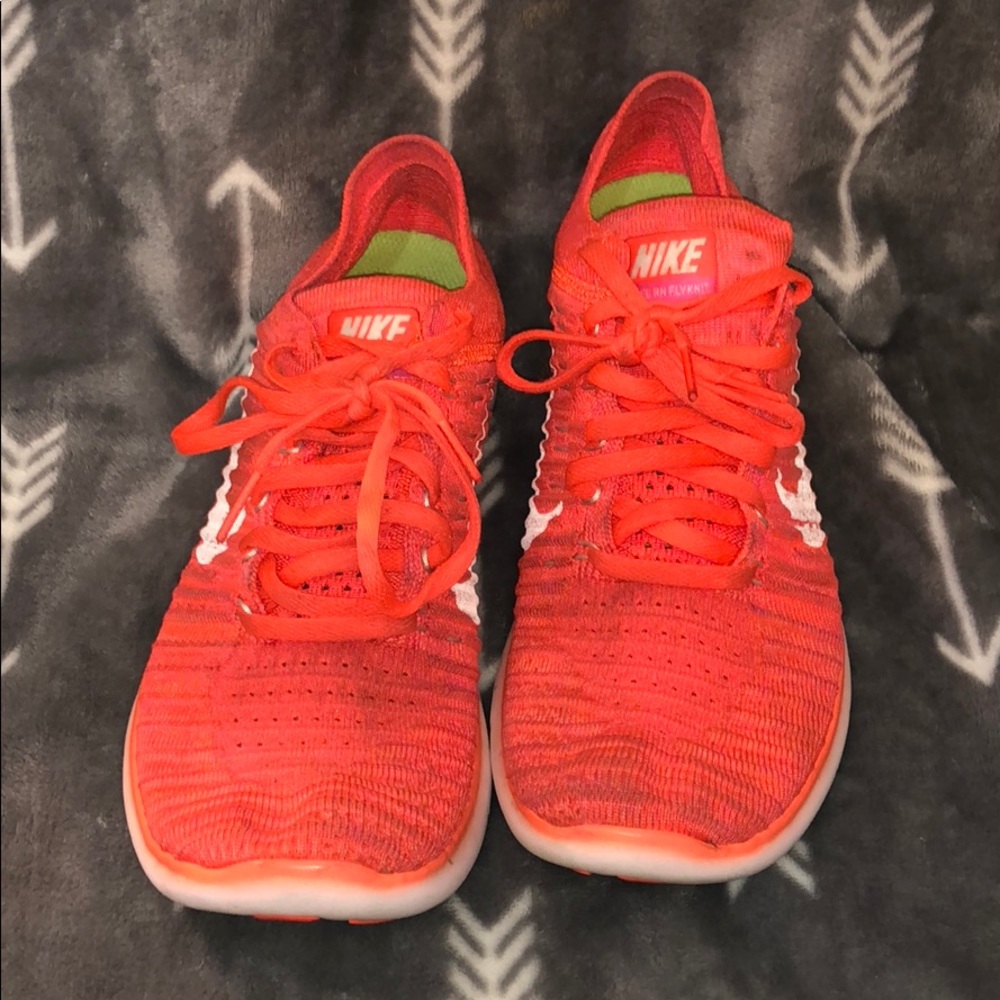Orange Nike Flyknit Sneakers